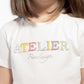 T-shirt con applicazioni cristalli colorati